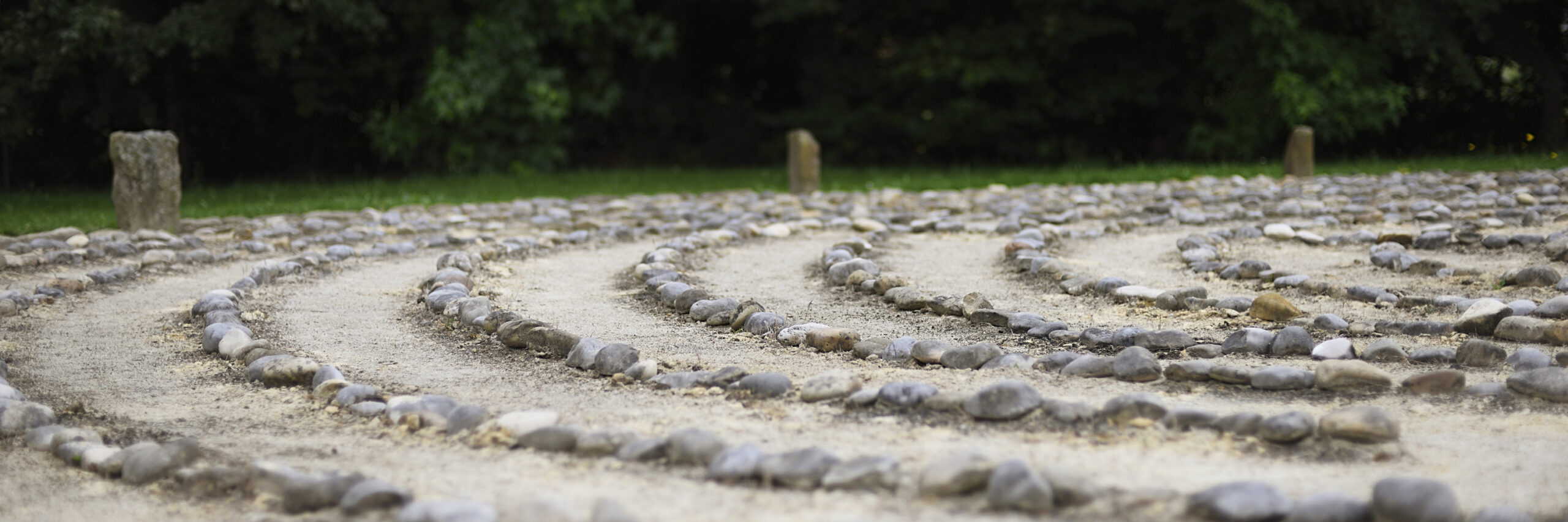 image of stones laid on the ground in concentric circles indicating part of a labyrinth